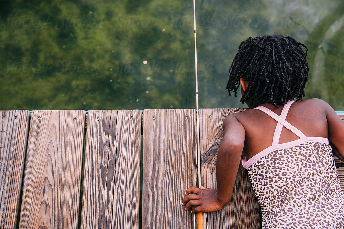 Girl fishing on dock