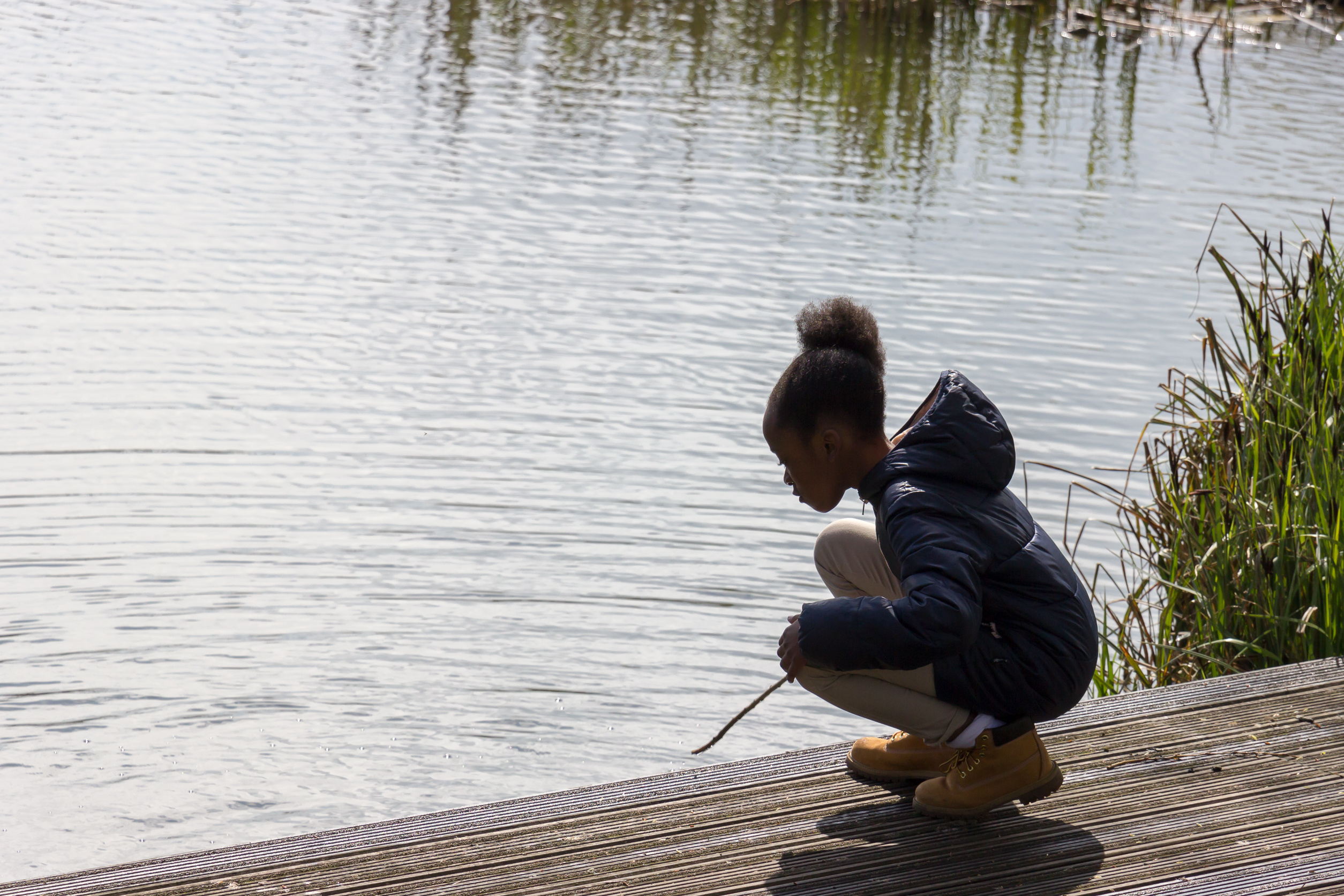 Young girl learning to fish